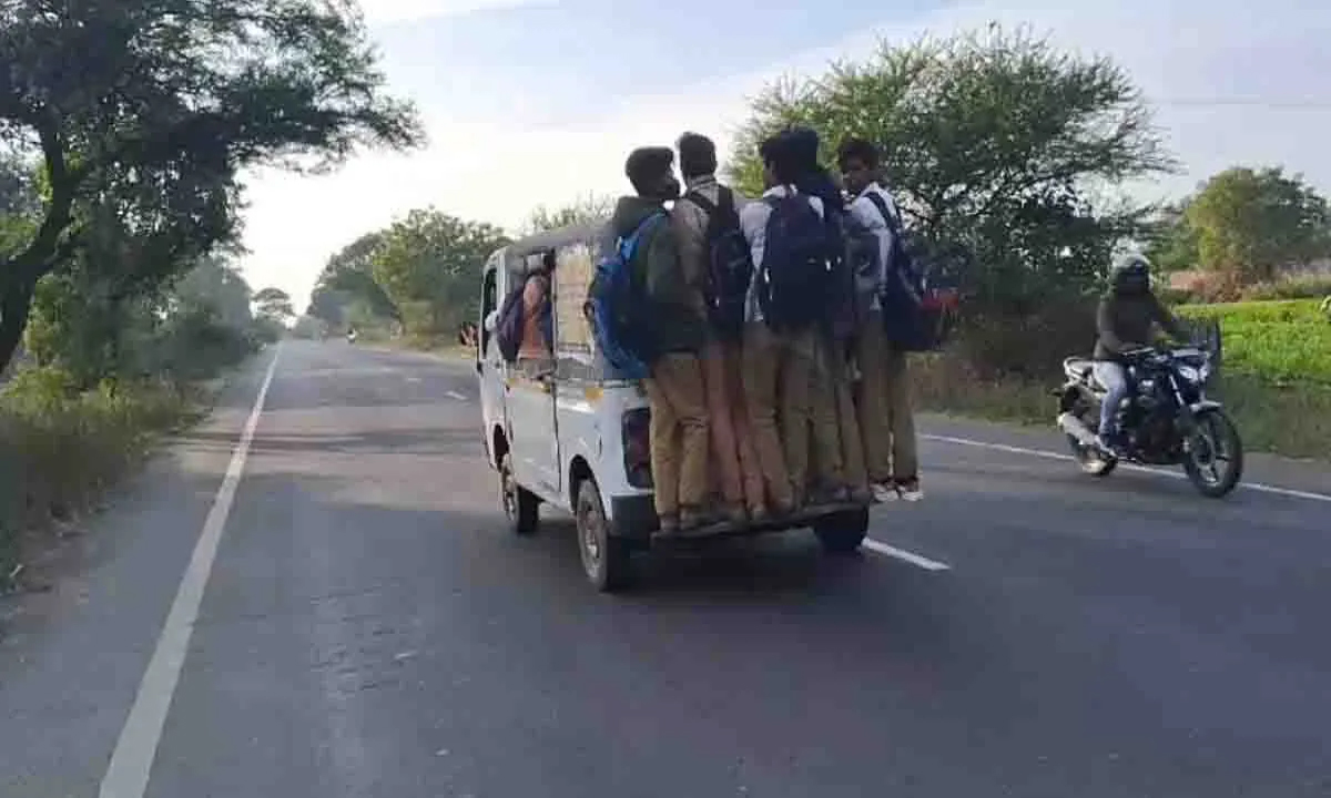 School students doing stunts by hanging from auto, watch video