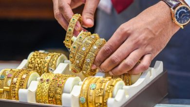 Gold rises, silver slips after record high