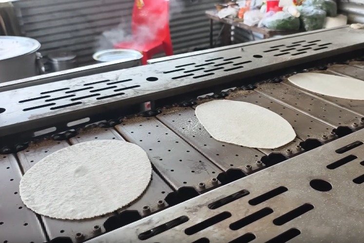 Machines are preparing Prasad for lakhs of devotees at the Magh Mela in Prayagraj.